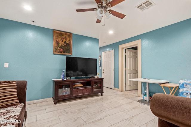 2747 E Wier Ave, Phoenix, AZ 85040 - living room with visible vents, a ceiling fan, and a textured wall