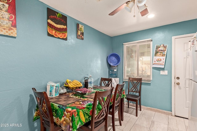 2747 E Wier Ave, Phoenix, AZ 85040 - dining area with a ceiling fan, baseboards, and a textured wall