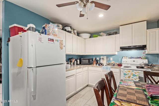 2747 E Wier Ave, Phoenix, AZ 85040 - kitchen featuring white appliances, ceiling fan, under cabinet range hood, and white cabinets