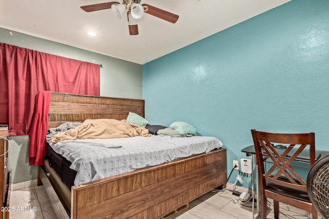 2747 E Wier Ave, Phoenix, AZ 85040 - bedroom with a ceiling fan, a textured wall, and marble finish floor
