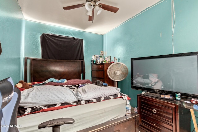 2747 E Wier Ave, Phoenix, AZ 85040 - bedroom featuring ceiling fan and a textured wall