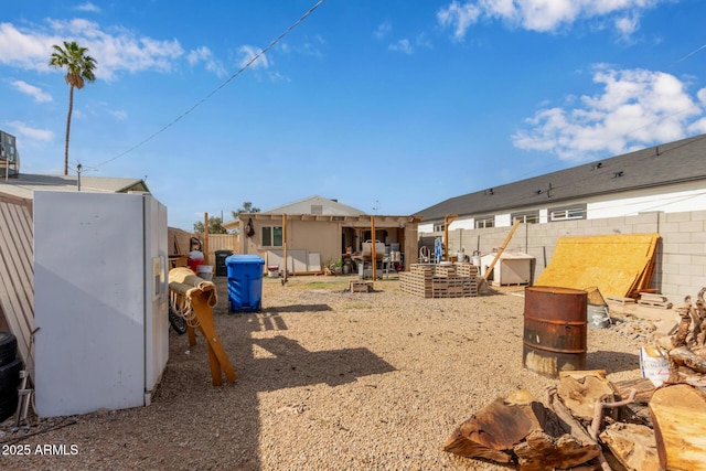 2747 E Wier Ave, Phoenix, AZ 85040 - view of yard with a fenced backyard and a fire pit