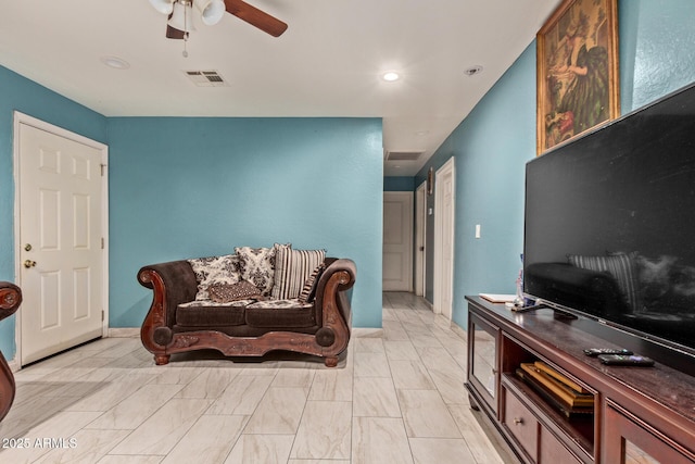 2747 E Wier Ave, Phoenix, AZ 85040 - living area featuring visible vents, marble finish floor, and ceiling fan