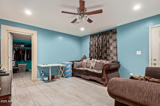 2747 E Wier Ave, Phoenix, AZ 85040 - living area featuring a ceiling fan, visible vents, marble finish floor, a textured wall, and recessed lighting