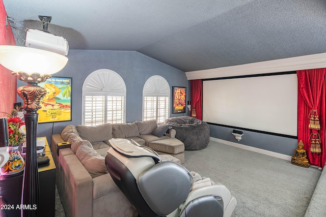 home theater featuring a textured ceiling, lofted ceiling, a wall mounted air conditioner, and carpet floors