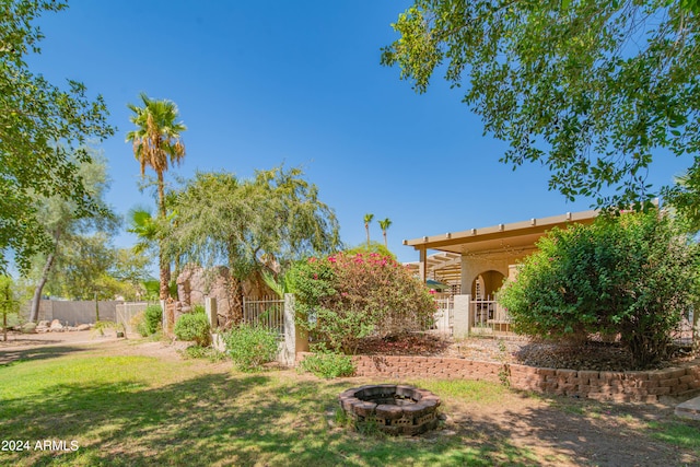 view of yard featuring a fire pit