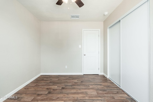 6223 W Earll Dr, Phoenix, AZ 85033 - unfurnished bedroom featuring a closet, wood finished floors, and ceiling fan