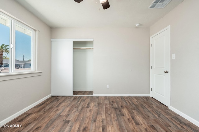 6223 W Earll Dr, Phoenix, AZ 85033 - unfurnished bedroom with wood finished floors, a closet, and ceiling fan