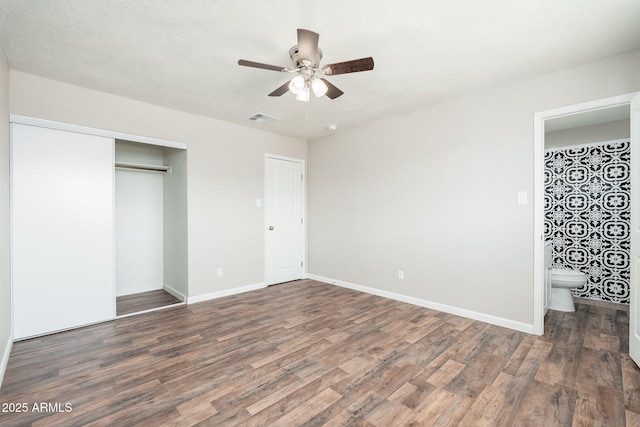 6223 W Earll Dr, Phoenix, AZ 85033 - unfurnished bedroom featuring wood finished floors, a closet, ceiling fan, and ensuite bath