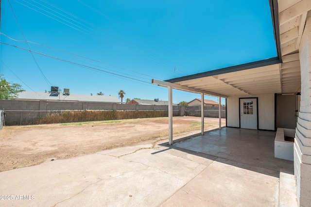 6223 W Earll Dr, Phoenix, AZ 85033 - view of patio with concrete driveway and an attached carport