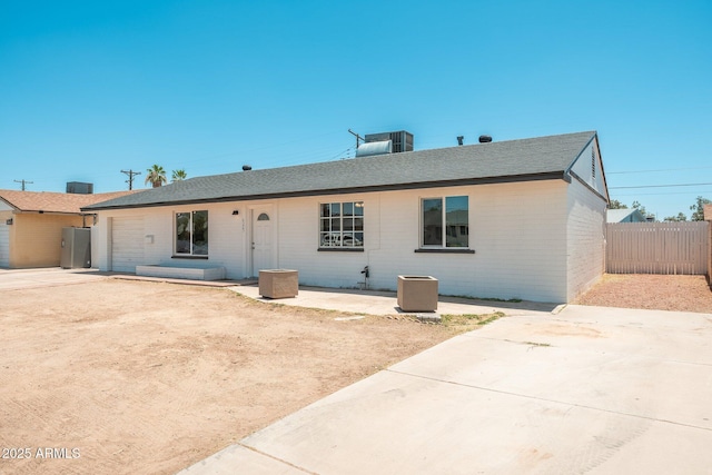 6223 W Earll Dr, Phoenix, AZ 85033 - back of house featuring a patio area, brick siding, and a shingled roof