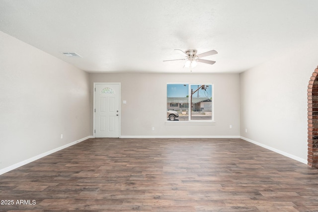 6223 W Earll Dr, Phoenix, AZ 85033 - unfurnished living room featuring ceiling fan and dark wood-style floors