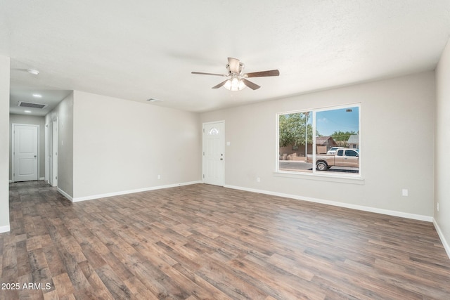 6223 W Earll Dr, Phoenix, AZ 85033 - unfurnished living room with ceiling fan and wood finished floors