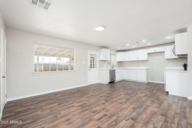 6223 W Earll Dr, Phoenix, AZ 85033 - kitchen featuring stainless steel dishwasher, dark wood-style floors, light countertops, white cabinetry, and recessed lighting