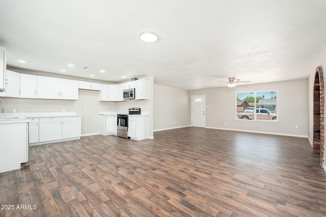 6223 W Earll Dr, Phoenix, AZ 85033 - unfurnished living room with dark wood-style floors, ceiling fan, and recessed lighting