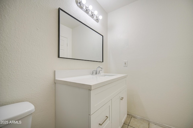 2846 N 46th Ave Unit 7, Phoenix, AZ 85035 - half bath featuring vanity, tile patterned flooring, and toilet