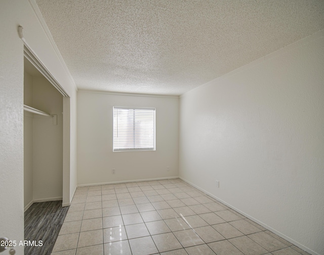 2846 N 46th Ave Unit 7, Phoenix, AZ 85035 - unfurnished bedroom with a textured ceiling and a closet