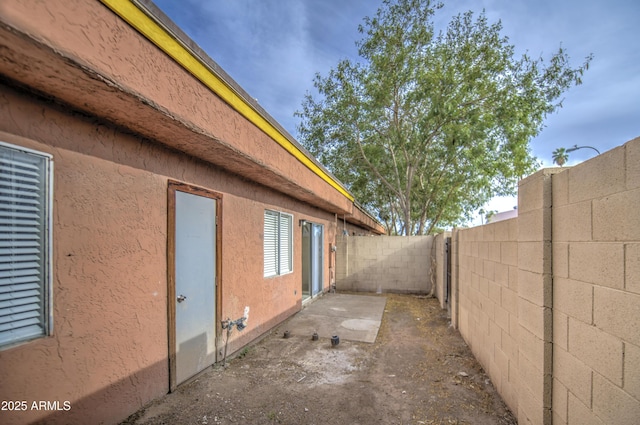 2846 N 46th Ave Unit 7, Phoenix, AZ 85035 - view of side of property with a fenced backyard and stucco siding