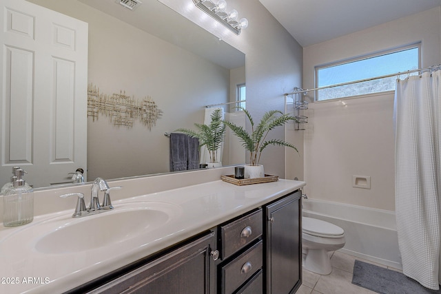 full bathroom featuring tile patterned flooring, vanity, toilet, and shower / bath combo with shower curtain