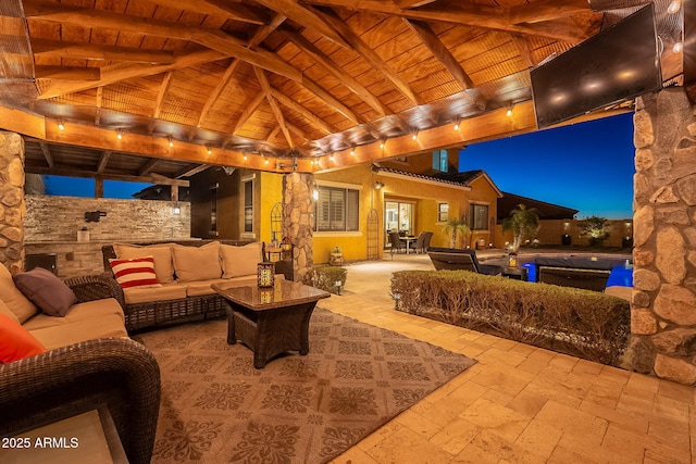 view of patio featuring an outdoor living space and a gazebo