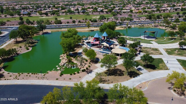 drone / aerial view featuring a water view and a residential view