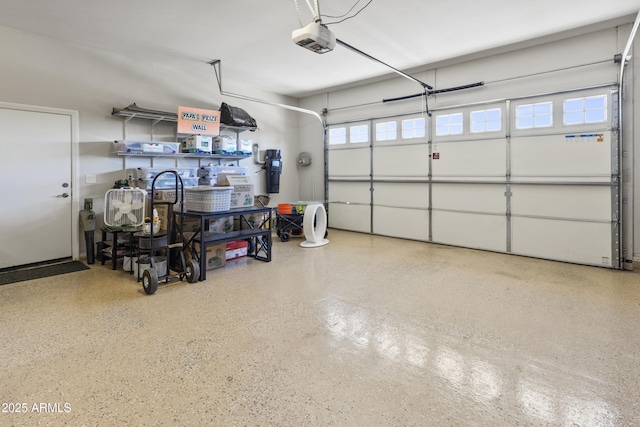 garage featuring a garage door opener