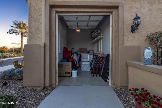 view of exterior entry with stucco siding