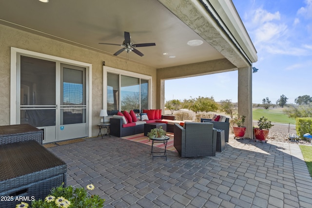 view of patio with ceiling fan, fence, and an outdoor hangout area