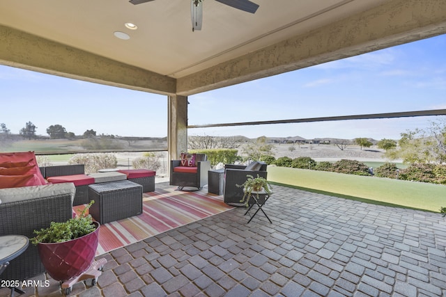 view of patio featuring a ceiling fan and outdoor lounge area