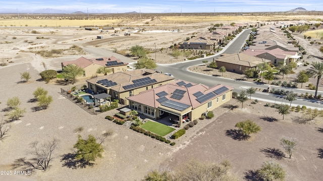 birds eye view of property with view of desert