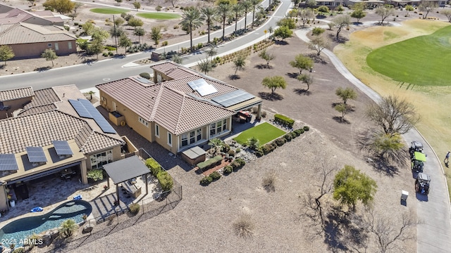 bird's eye view with view of golf course and a residential view