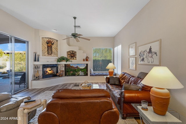 living room with ceiling fan and wood-type flooring