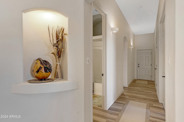 hallway with light hardwood / wood-style flooring