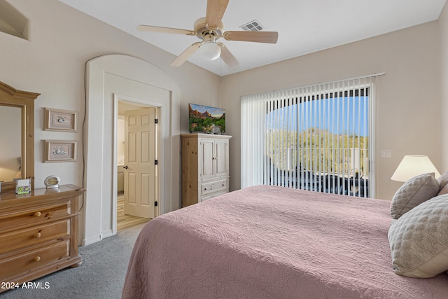 bedroom featuring access to exterior, ensuite bathroom, light carpet, and ceiling fan