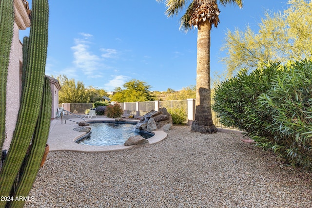 view of pool featuring a patio and pool water feature