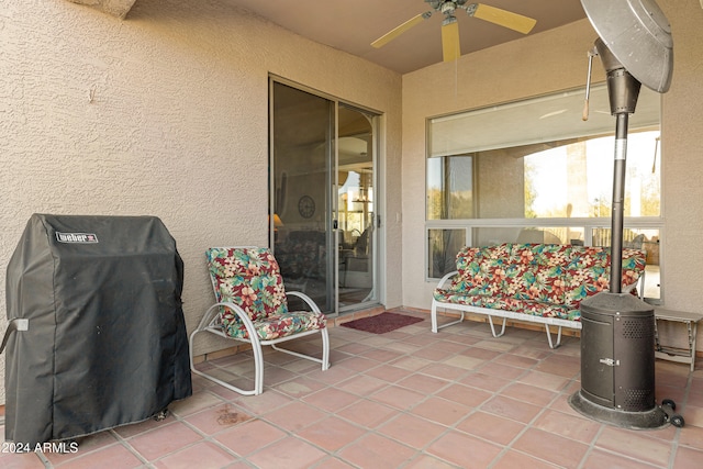 view of patio featuring area for grilling and ceiling fan