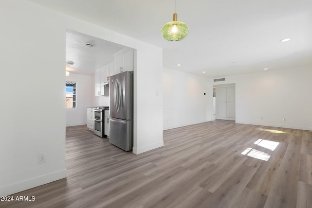 unfurnished living room with light hardwood / wood-style flooring