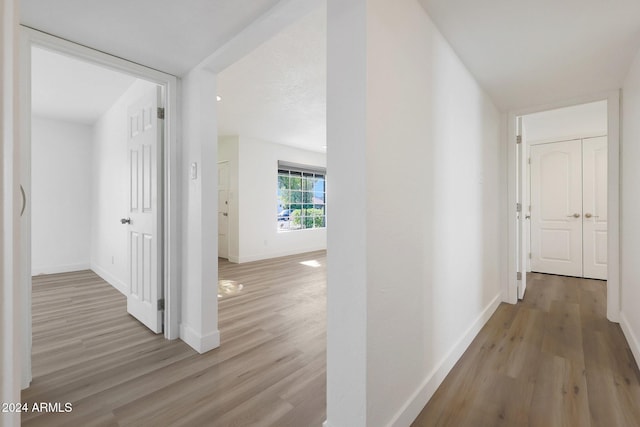 corridor featuring light hardwood / wood-style flooring