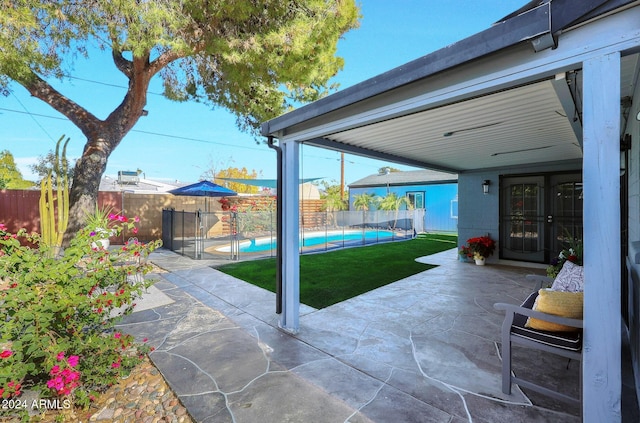 view of patio / terrace featuring a fenced in pool