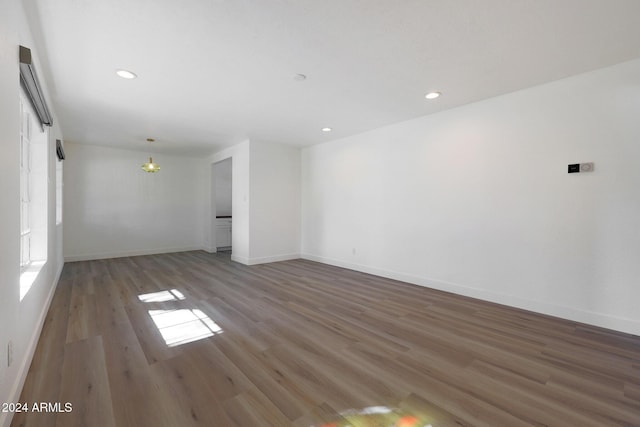 spare room with hardwood / wood-style floors