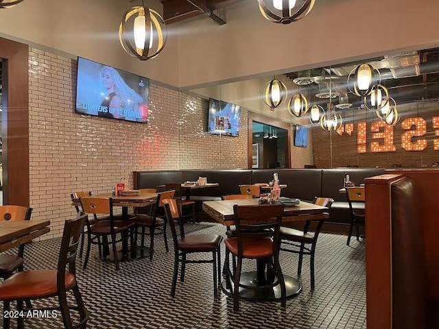 dining area with brick wall