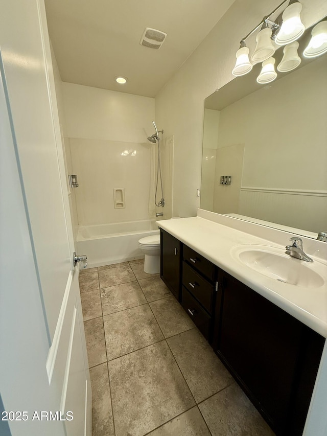 full bathroom featuring toilet, vanity, and bathtub / shower combination