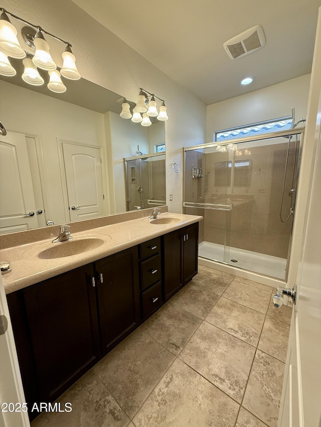 bathroom featuring walk in shower and vanity