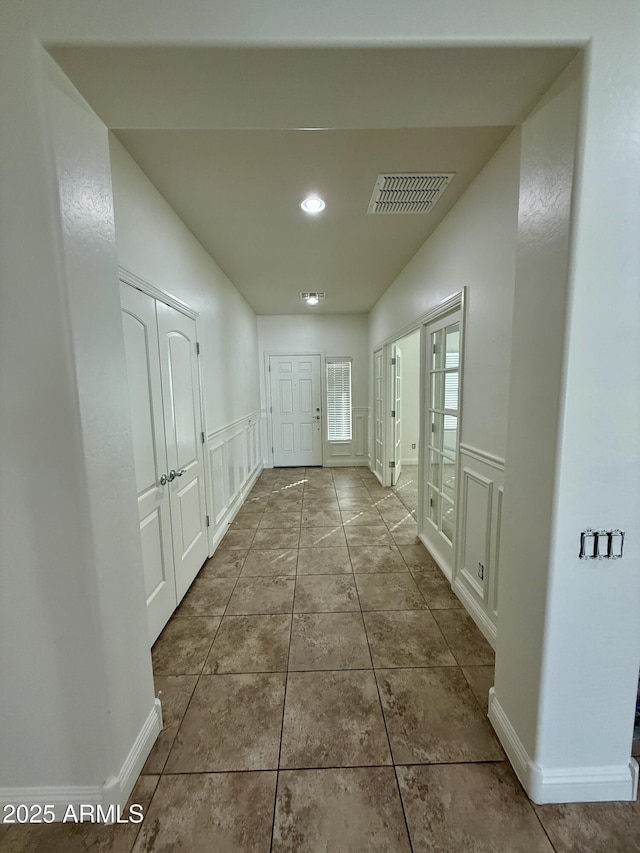 hall featuring tile patterned floors