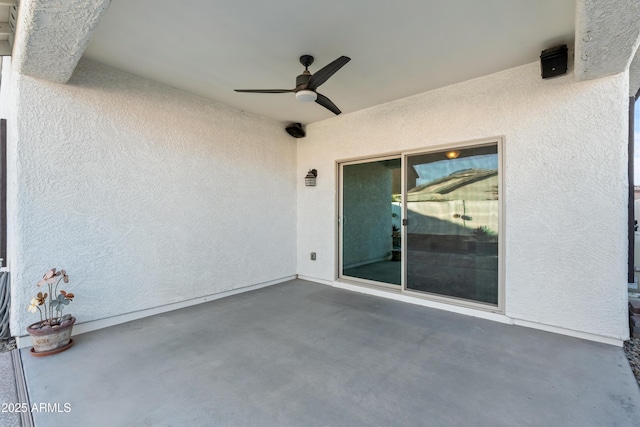 view of patio / terrace featuring ceiling fan