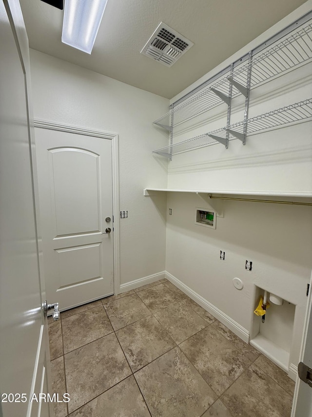 clothes washing area featuring hookup for a washing machine and gas dryer hookup