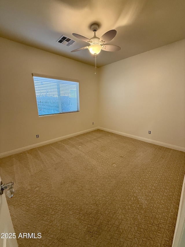 unfurnished room featuring carpet floors and ceiling fan