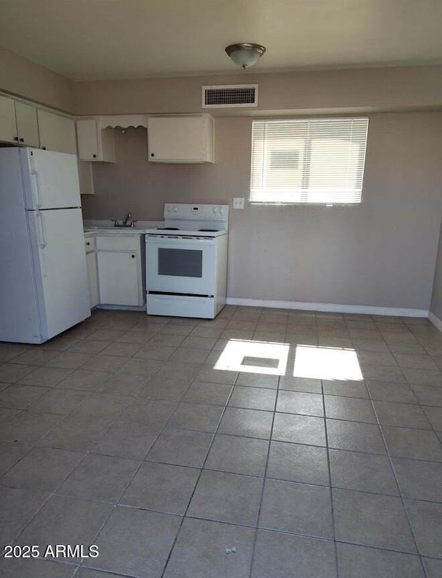 761 E Millett Ave, Mesa, AZ 85204 - kitchen with white appliances, white cabinets, light countertops, and a sink