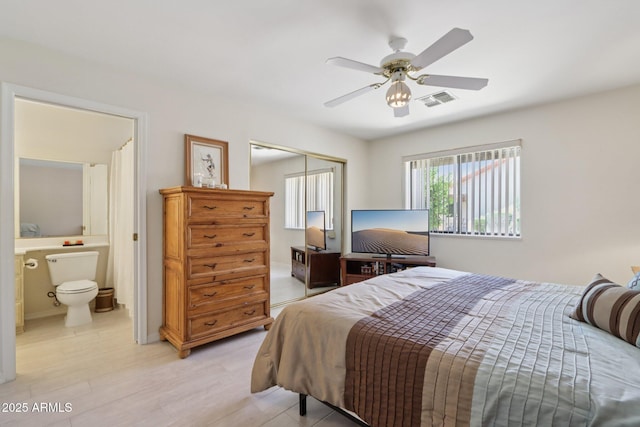 2055 N 56th St Unit 15, Mesa, AZ 85215 - bedroom with a closet, ensuite bath, and ceiling fan