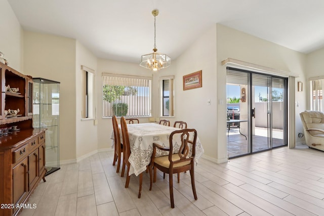 2055 N 56th St Unit 15, Mesa, AZ 85215 - dining area with a chandelier and light wood-type flooring